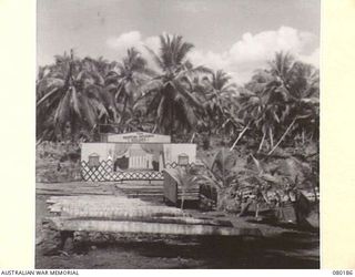 SIAR, NEW GUINEA. 1944-07-07. "THE FIGHTING 15TH FOLLIES" SCENIC STAGE AND CINEMA THEATRE AT HEADQUARTERS 15TH INFANTRY BRIGADE. NOTE THE USE OF THE COCONUT PALMS TO FORM SEATING