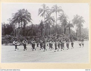 TOROKINA, BOUGAINVILLE. 1945-10-22. A CEREMONIAL PARADE AND MARCH PAST BY 29 INFANTRY BRIGADE WAS HELD FOR MAJOR GENERAL W. BRIDGEFORD, GENERAL OFFICER COMMANDING 3 DIVISION, AT TOROKINA AIRFIELD. ..