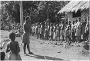 People lined up in front of decorated house