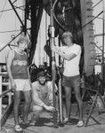 Left to right: Jerry Carter, a graduate student, and scientists Grant Blackinton and Donald Hussong all from the Hawaii Institute of Geophysics. They are preparing the fordescent instrument which is closing on the drill string on the deck of the D/V Glomar Challenger during OBSS Experiment on Leg 67 of the Deep Sea Drilling Project. 1979