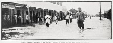 Fijian townships invaded by devastating floods: a scene in the main street of Nausori