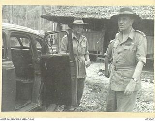 AITAPE, NEW GUINEA. 1945-03-23. LORD WAKEHURST, KCMG, GOVERNOR OF NEW SOUTH WALES (2) ABOUT TO ENTER HIS CAR AFTER INSPECTING THE HEADQUARTERS OF THE AUSTRALIAN NEW GUINEA ADMINISTRATIVE UNIT