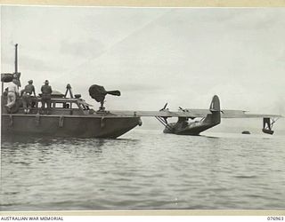 JACQUINOT BAY, NEW BRITAIN. 1944-11-14. A UNITED STATES ARMY PATROL BOAT TAKING THE GENERAL OFFICER COMMANDING 5TH DIVISION OUT TO THE RAAF CATALINA FLYING BOAT FOR HIS RETURN TRIP TO NEW GUINEA