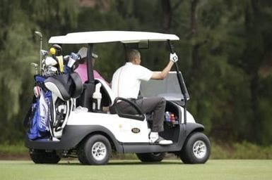 Barack Obama plays golf with Prime Minister Najib Razak, Joe Paulsen, and Mike Brush in Kaneohe Bay, Hawaii, December 24, 2014