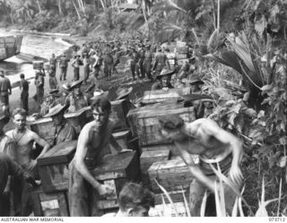 SARANG, NEW GUINEA. 1944-05-31. TROOPS AND STORES OF THE 37/52ND INFANTRY BATTALION BEING LANDED AT THE BEACH. THE AREA IS IN USE AS A FORWARD BASE IN PREPARING FOR THE ATTACK AGAINST KARKAR ..