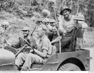 KILIGIA, NEW GUINEA. 1944-04-04. AMERICAN SERVICEMEN RETURNING WITH RELICS FROM A BATTLEFIELD. THE SOUVENIR HUNTERS USUALLY COMPRISE AMERICAN NEWCOMERS TO THE AREA