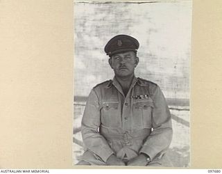 LAE, NEW GUINEA. 1945-10-05. BRIGADIER A.L. DAWKINS, DIRECTOR OF MEDICAL SERVICES, HEADQUARTERS FIRST ARMY