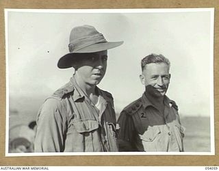 MILNE BAY, NEW GUINEA, 1943-07-12. OFFICERS OF THE 4TH AUSTRALIAN FIELD COMPANY, ROYAL AUSTRALIAN ENGINEERS, AIF. THEY ARE: VX39028 CAPTAIN J. G. S. NELSON, COMMANDING OFFICER (LEFT); VX117129 ..