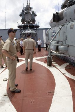 US Navy (USN) Lieutenant Commander (LCDR) Brett Stevens, looks over a Russian Federation Navy (RFN) KA-27 Helix helicopter, during his visit and tour aboard the RFN Udaloy Class Guided Missile Destroyer, MARSHAL SHAPOSHNIKOV, at Naval Base, Santa Rita, Guam (GU). The SHAPOSHNIKOV is one of four RFN ships participating with US Navy Ships in Passing Exercise 2006 (PASSEX 06) off the coast of Guam. PASSEX 06 is an exercise designed to increase interoperability between the two navies while enhancing the strong cooperative relationship between Russia and the United States