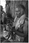 Folofo'u performing divination with cordyline leaves