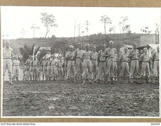 SOGERI, NEW GUINEA. 1943-11-20. UNITED STATES ARMY INSTRUCTORS AT THE SCHOOL OF SIGNALS, NEW GUINEA FORCE ON THE DAILY UNIT PARADE