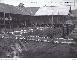 LAE, NEW GUINEA. 1945-12. EXTERIOR VIEW OF THE MENS MESS OF 4TH ADVANCED ORDNANCE DEPOT. (DONOR: J. W. K. BEDDOME)