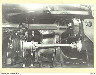 TOROKINA, BOUGAINVILLE ISLAND. 1945-02-22. THE POWER TAKE- OFF AND MULTI- BELT PULLEY OF THE SLAVE CHARGING INSTALLATION FOR JEEPS DESIGNED AND FITTED BY PERSONNEL OF B SQUADRON WORKSHOP, 2/4TH ..