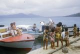 Federated States of Micronesia, group of children welcoming tourists at waterfront in Chuuk State
