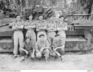 Group portrait of the personnel of No. 6 Troop, B Squadron, 2/4th Armoured Regiment. Left to right, back row: WX16726 Trooper (Tpr) G A Van-Rompaey of Victoria Park, WA; NX147039 Tpr G M Yabsley of ..
