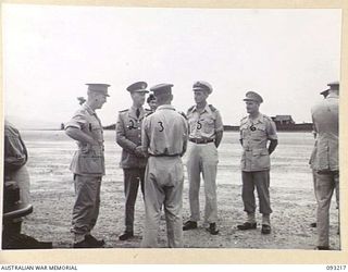 JACQUINOT BAY, NEW BRITAIN, 1945-06-16. THE GOVERNOR GENERAL OF NEW ZEALAND, MARSHAL OF THE ROYAL AIR FORCE, SIR CYRIL L.N. NEWALL (2) WITH A GROUP OF SENIOR OFFICERS ON ARRIVAL AT HQ 5 DIVISION ..