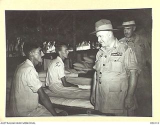 AITAPE, NEW GUINEA. 1945-03-20. GENERAL SIR THOMAS A. BLAMEY, COMMANDER-IN-CHIEF, ALLIED LAND FORCES, SOUTH WEST PACIFIC AREA (3), TALKING TO CORPORAL A. FINDLAY, 2/5 INFANTRY BATTALION (1), WHILE ..