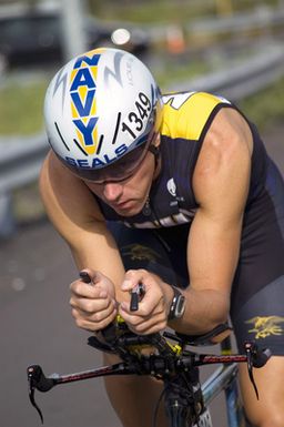 U.S. Navy Special Operations CHIEF Mitch Hall, assigned to the Naval Special Warfare Center, road tests his Navy SEAL racing bike prior to the start of the 2006 Iron-man Triathlon World Championship competition at Kailua-Kona, Hawaii, on Oct. 20, 2006. This year's event marks the second time that Hall was officially sponsored by his command to assist in the Sea, Air, and Land Unit recruiting efforts. (U.S. Navy photo by Mass Communication SPECIALIST 3rd Class Ben A. Gonzales) (Released)