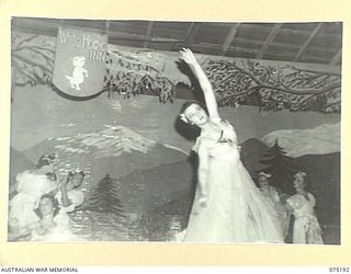 LAE, NEW GUINEA. 1944-08-11. MISS THEA MUNRO, AUSTRALIAN RED CROSS SOCIETY, 2/7TH GENERAL HOSPITAL, DANCING DURING A CONCERT STAGED BY THE WHITE HORSE INN CONCERT PARTY FOR THE PATIENTS OF THE ..