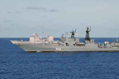 The Russian Federation Navy Udaloy (Fregat) Class (Type 1155) Destroyer MARSHAL SHAPOSHNIKOV (DDG 543) (foreground) and US Navy (USN) Ticonderoga Class Guided Missile Cruiser (Aegis) USS COWPENS (CG 63), underway in the Pacific Ocean, during the opening phases of a joint US-Russian Naval Exercise. A Russian Federation Navy vessel made the first visit to the US Territory of Guam in order to participate in a joint humanitarian assistance and disaster relief exercise