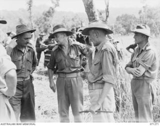 GUSIKA, NEW GUINEA. 1944-03-15. SENIOR OFFICERS ATTENDING VULNERABILITY TESTS ON A CUPOLA FITTED TO THE BASE OF A MATILDA TANK BY THE 1ST TANK BATTALION. IDENTIFIED PERSONNEL ARE: VX89 BRIGADIER L. ..