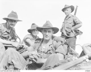 DANMAP RIVER AREA, NEW GUINEA. 1944-12-28. TROOPS OF THE 2/11TH INFANTRY BATTALION RESTING DURING A PATROL THROUGH ENEMY OCCUPIED COUNTRY. IDENTIFIED PERSONNEL ARE:- PRIVATE L. CLARKE (1); CORPORAL ..