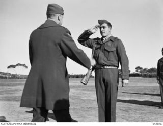 MOUNT MARTHA, VIC. 1943-05-18. A VERY PROUD MOMENT IN THIS U.S. MARINE'S LIFE WHEN HE RECEIVES A DECORATION FROM HIS COMMANDING GENERAL. HE IS PLATOON SERGEANT JOHN BASILONE (RIGHT) OF THE SEVENTH ..