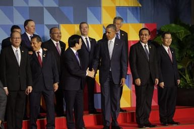 Barack Obama joins Asia Pacific Economic Cooperation Summit leaders for a photo in Manila, Philippines, November 19, 2015