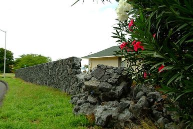 [Earthquake] Waikola Village, HI, October 23, 2006 - A resident's perimeter wall was crumbled by a series of two powerful earthquakes that struck the Island of Hawaii. Adam DuBrowa/FEMA.