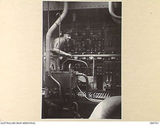 MIOS WUNDI, DUTCH NEW GUINEA. 1944-11-12. CHIEF ENGINE ROOM ARTIFICER R F SHAW AT WORK ABOARD HMAS STAWELL WHILE THE VESSEL IS IN HARBOUR