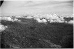 Aerial view of mountains and horizon of clouds