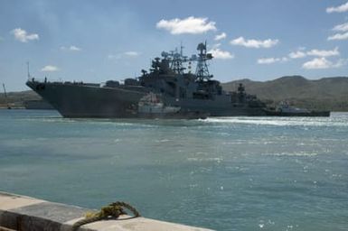 A port bow view showing the Russian Federated Navy (RFN) Udaloy Class Guided Missile Destroyer, MARSHAL SHAPOSHNIKOV, being assisted by tugboats, as it gets underway at Santa Rita Naval Base, Guam (GU) to participate in Passing Exercise 2006 (PASSEX 06). The SHAPOSHNIKOV, is one of four RFN ships participating with US Navy (USN) ships off the coast of Guam in the exercise designed to increase interoperability between the two navies while enhancing the strong cooperative relationship between Russia and the US