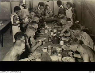 Yule Island, New Guinea. c. 1944-05-15. Members of 1 Marine Food Supply Platoon having breakfast before going fishing. In civilian life most of these men were professional fishermen. (For ..