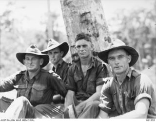 UBERI, NEW GUINEA. 1943-12-19. TROOPS OF THE 2/9TH AUSTRALIAN INFANTRY BATTALION WHO PLAYED THE PART OF EXTRAS DURING THE FILMING OF THE PRODUCTION, "RATS OF TOBRUK" BY CHAUVEL'S PRODUCTIONS, ON ..