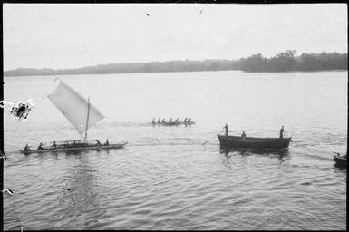 Canoe with a sail, a canoe being paddled and a European style boat, Lorengau, Manus Island, New Guinea, 1935 / Sarah Chinnery