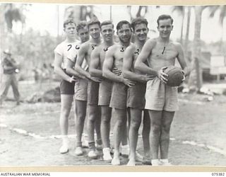 MILILAT, NEW GUINEA. 1944-08-20. MEMBERS OF THE BASKETBALL TEAM FROM THE HMAS "MANOORA" WHICH IS TO PLAY A TEAM FROM HEADQUARTERS, 5TH DIVISION DURING A INTER-UNIT SPORTS MEETING. IDENTIFIED ..