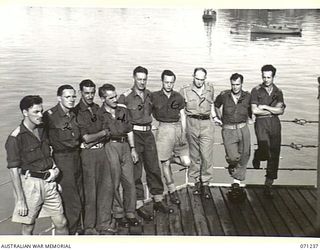 MILNE BAY, PAPUA, 1944-03-04. MEMBERS OF THE MILITARY HISTORY SECTION PICTURED ABOARD THE H.T. TAROONA ON ARRIVAL AT MILNE BAY FROM TOWNSVILLE, QUEENSLAND. IDENTIFIED PERSONNEL ARE: NX191007 ..