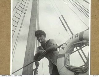 LAE, NEW GUINEA. 1944-06-14/02. NX4078 CAPTAIN D.F. HERBERT, ON THE BRIDGE OF HIS SHIP, THE AK94, 12TH WATER TRANSPORT OPERATING COMPANY