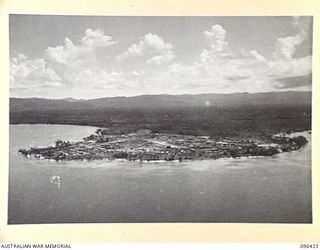 CAPE WOM, NEW GUINEA, 1945-09-12. AERIAL VIEW OF CAPE WOM. TROOPS OF 19 INFANTRY BRIGADE OCCUPIED CAPE WOM ON 1945-05-3. THEY FORCED THE JAPANESE TO WITHDRAW FROM PREPARED POSITIONS IN CAVES AND ..