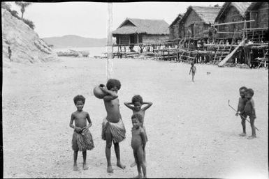 Elevala village piccaninnies standing on a beach, Port Moresby, Papua, ca. 1923, 3 / Sarah Chinnery