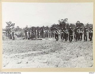 LAE AREA, NEW GUINEA. 1945-09-01. COLONEL J.T. SIMPSON, DEPUTY DIRECTOR OF ORDNANCE SERVICE, INSPECTED A PARADE OF THE ORDNANCE PERSONNEL UNDER HIS COMMAND IN THE LAE AREA, AT 4 ADVANCED ORDNANCE ..