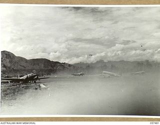 NADZAB, NEW GUINEA. 1943-09-20. TRANSPORT AIRCRAFT USED TO SUPPLY THE 7TH AUSTRALIAN DIVISION, LINED UP ON NO. 1 AIRSTRIP