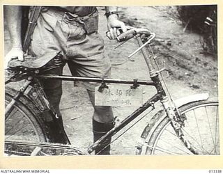 1942-10-01. NEW GUINEA. MILNE BAY. A BICYCLE USED DURING THE UNSUCCESSFUL JAPANESE ATTACK ON MILNE BAY