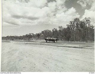 1942-12-01. NEW GUINEA. AMERICAN B26 MEDIUM BOMBER TAKING OFF TO BOMB JAPANESE POSITIONS IN THE BUNA AREA. (NEGATIVE BY BOTTOMLEY)