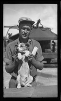 [Serviceman with Foo Foo the Dog]