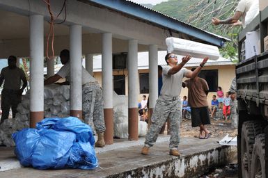 Earthquake ^ Tsunami - Asili, American Samoa, October 7, 2009 -- Members of Bravo Company, 100th Battalion, 442nd Infantry off-load much needed humanitarian supplies. American Samoa officials asked FEMA to establish this distribution center in the village of Asili to help the local community. David Gonzalez/FEMA