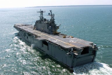 Port quarter stern view of the US Navy (USN) TARAWA CLASS: Amphibious Assault Ship USS SAIPAN (LHA 2) underway off the coast of Virginia Beach, Virginia (VA)