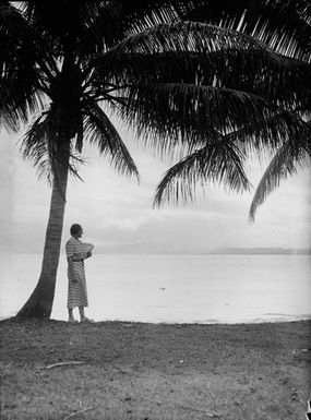 [Woman looking out to sea from Pacific Island waterfront]