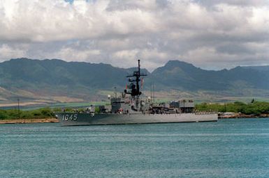 A port bow view of the frigate USS DAVIDSON (FF-1045) departing Pearl Harbor