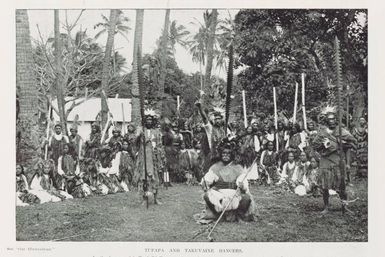 Tupapa and Takuvaine dancers. In the foreground is Te Ariki Taruare, who is said to be the last of the high priests of Rarotonga